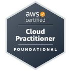 The image is a badge for AWS certification. It contains the text "aws certified" with an orange checkmark logo at the top. Below that, it says "Cloud Practitioner" and "FOUNDATIONAL" on a dark hexagonal background.